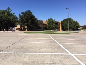 The parking lot sits empty as CEC's former  home awaits a new tenant. 9.14.2015